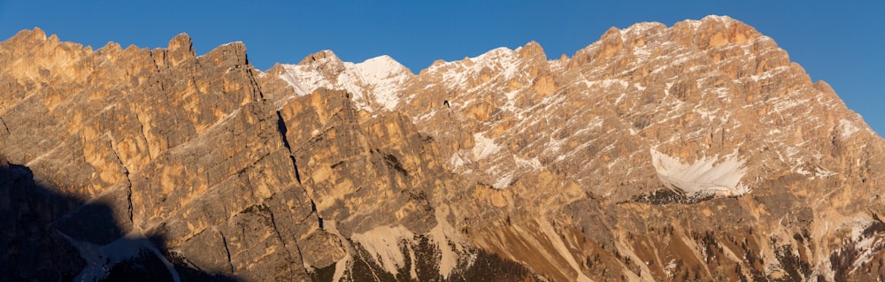 a view of the top of a mountain with snow on it