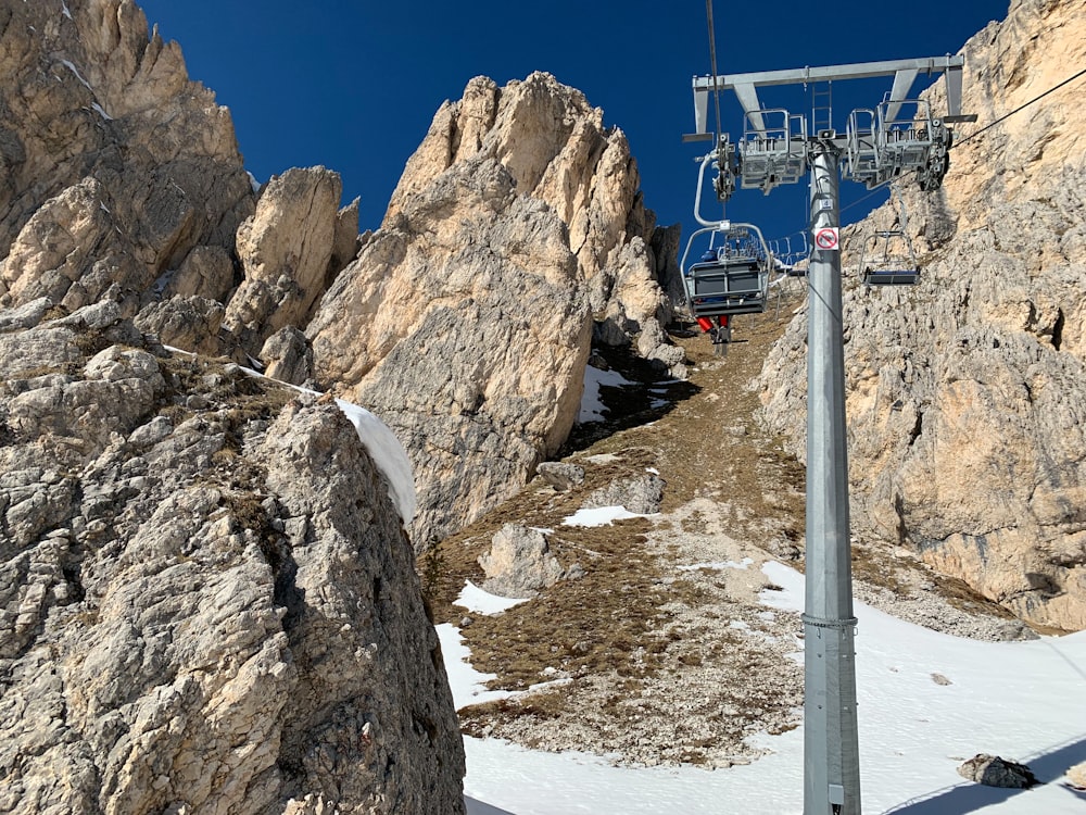 a ski lift going up the side of a mountain