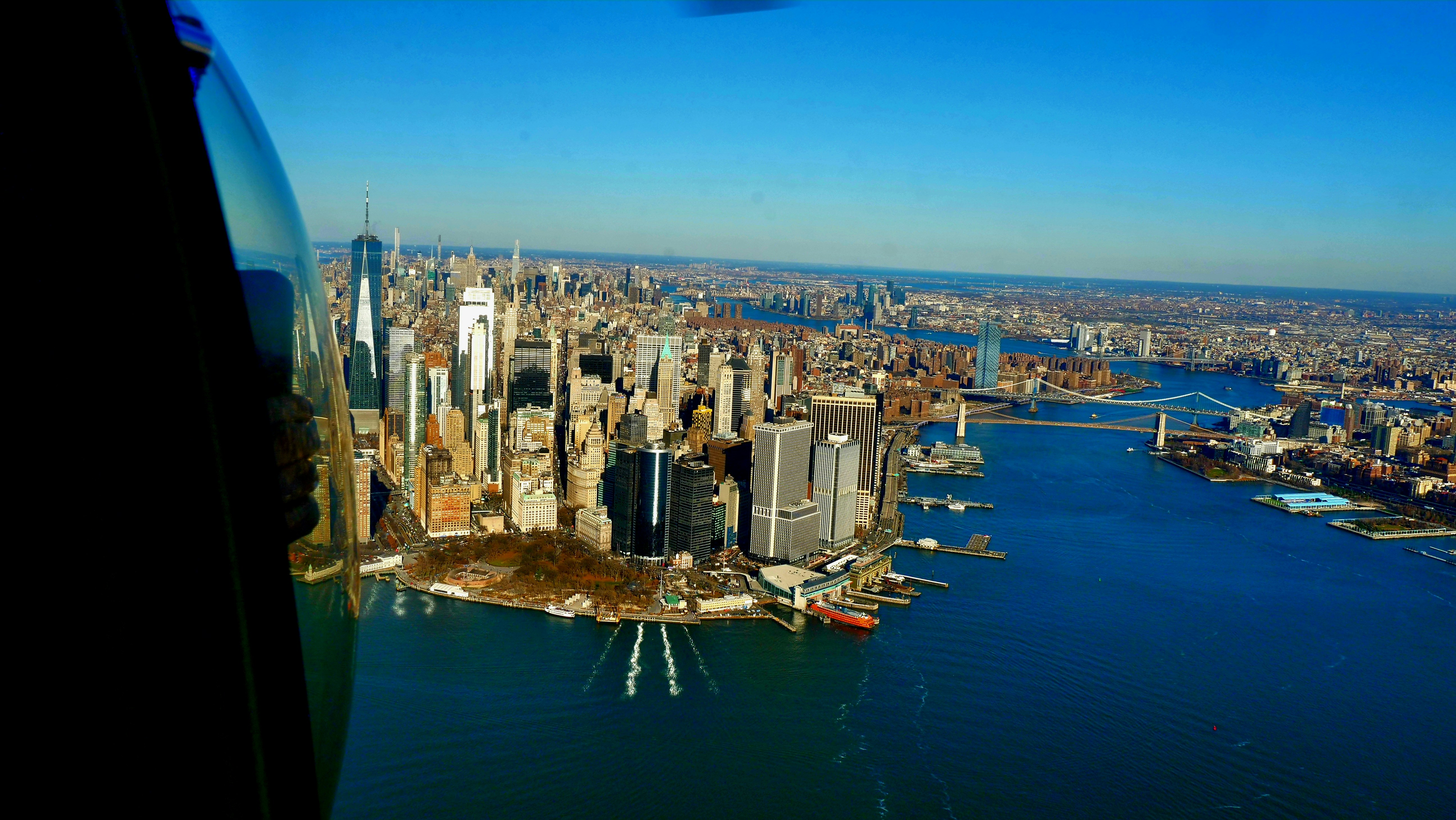 an aerial view of a city and a body of water