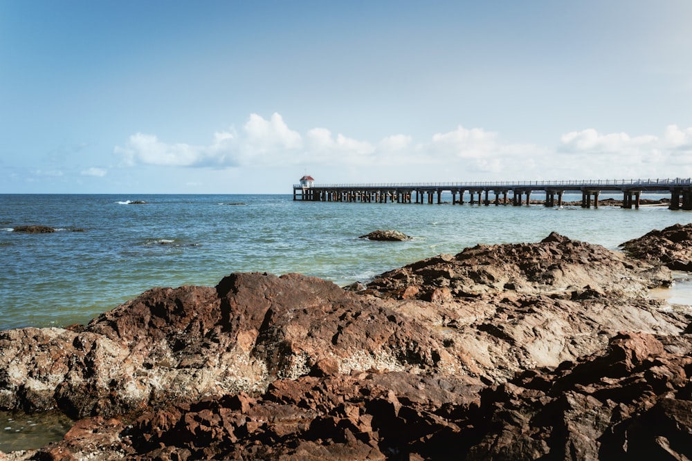 a long pier sitting over a large body of water