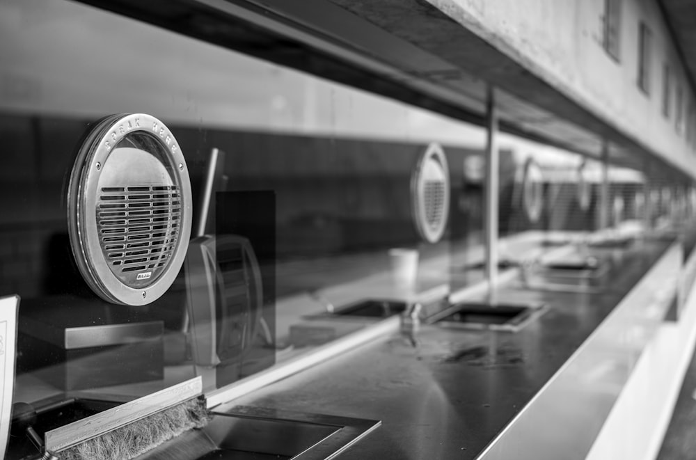 a black and white photo of a row of sinks