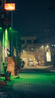 Nighttime highway view outside x1 भोजनालय with welcoming maroon and saffron lights.