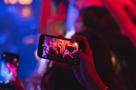 A close-up of a high-quality camera capturing a vibrant performance.