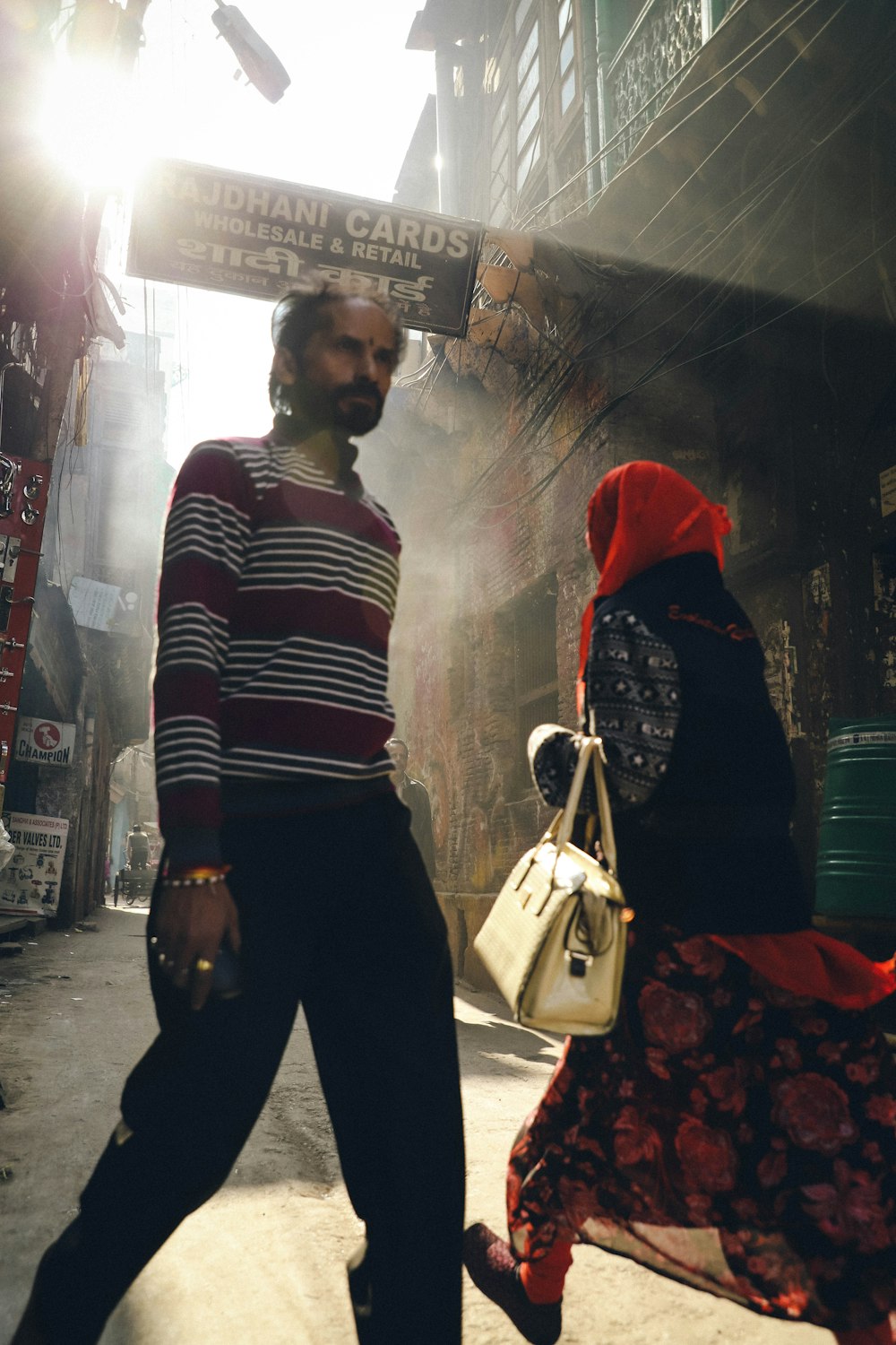 a man and a woman walking down a street