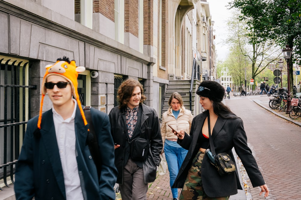 a group of people walking down a street