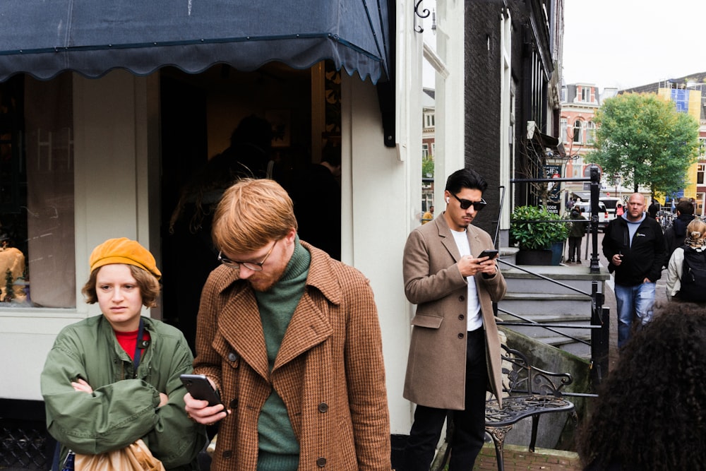 a group of people standing outside of a building