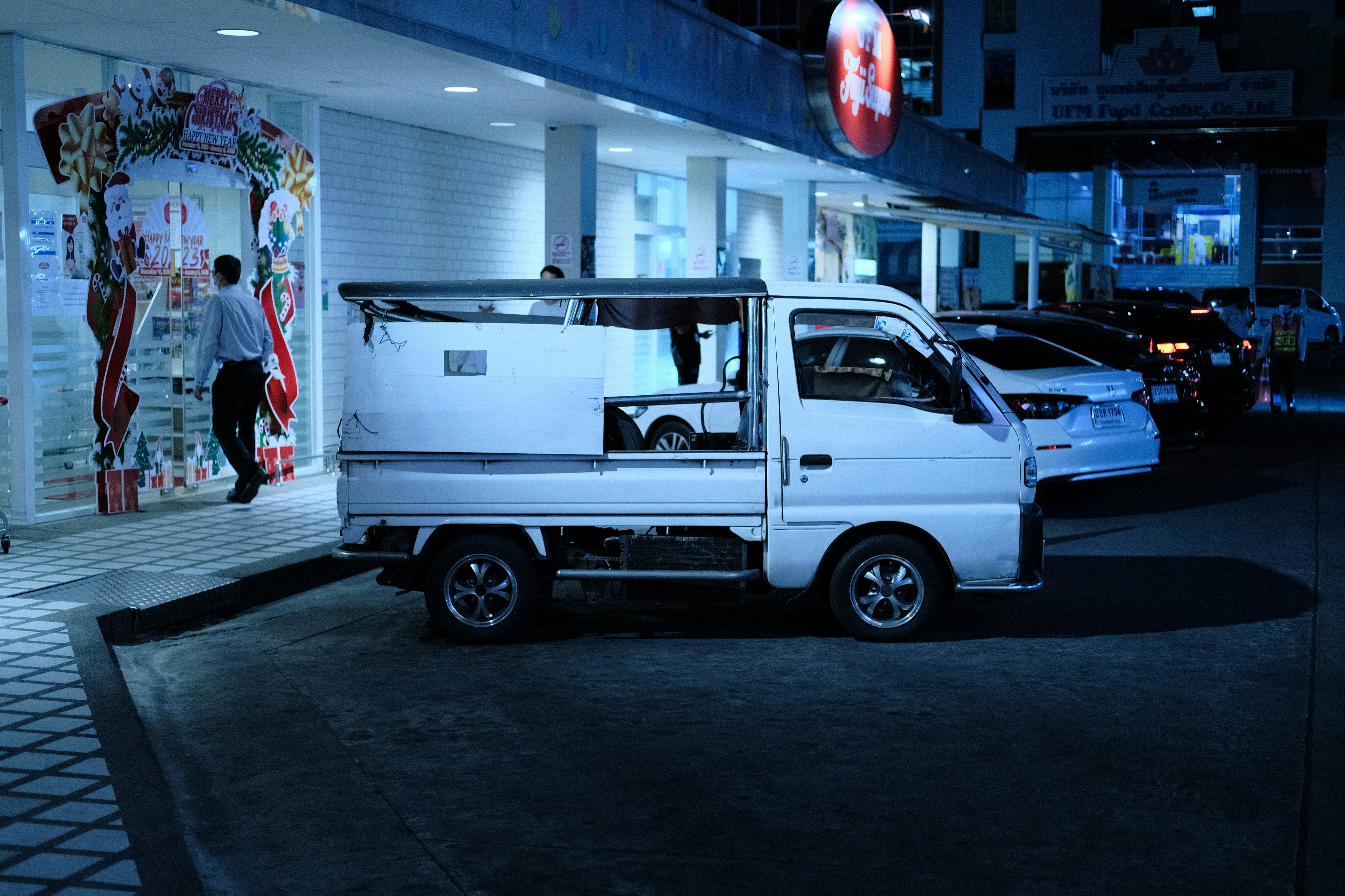 a white truck parked in front of a building