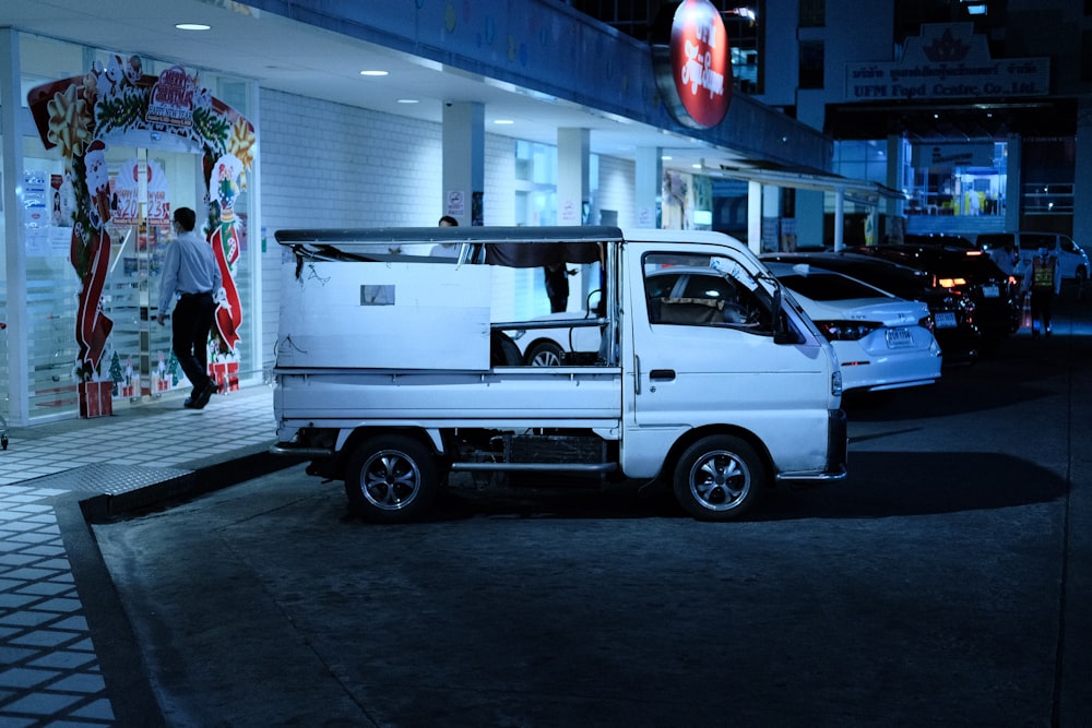 a white truck parked in front of a building