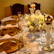 Luxurious banquet table with modern furniture and delicate golden accents.