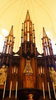 An intricate altar adorned with crystals, herbs, and a hand-carved wooden pentacle.