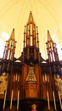 An intricate altar adorned with crystals, herbs, and a hand-carved wooden pentacle.