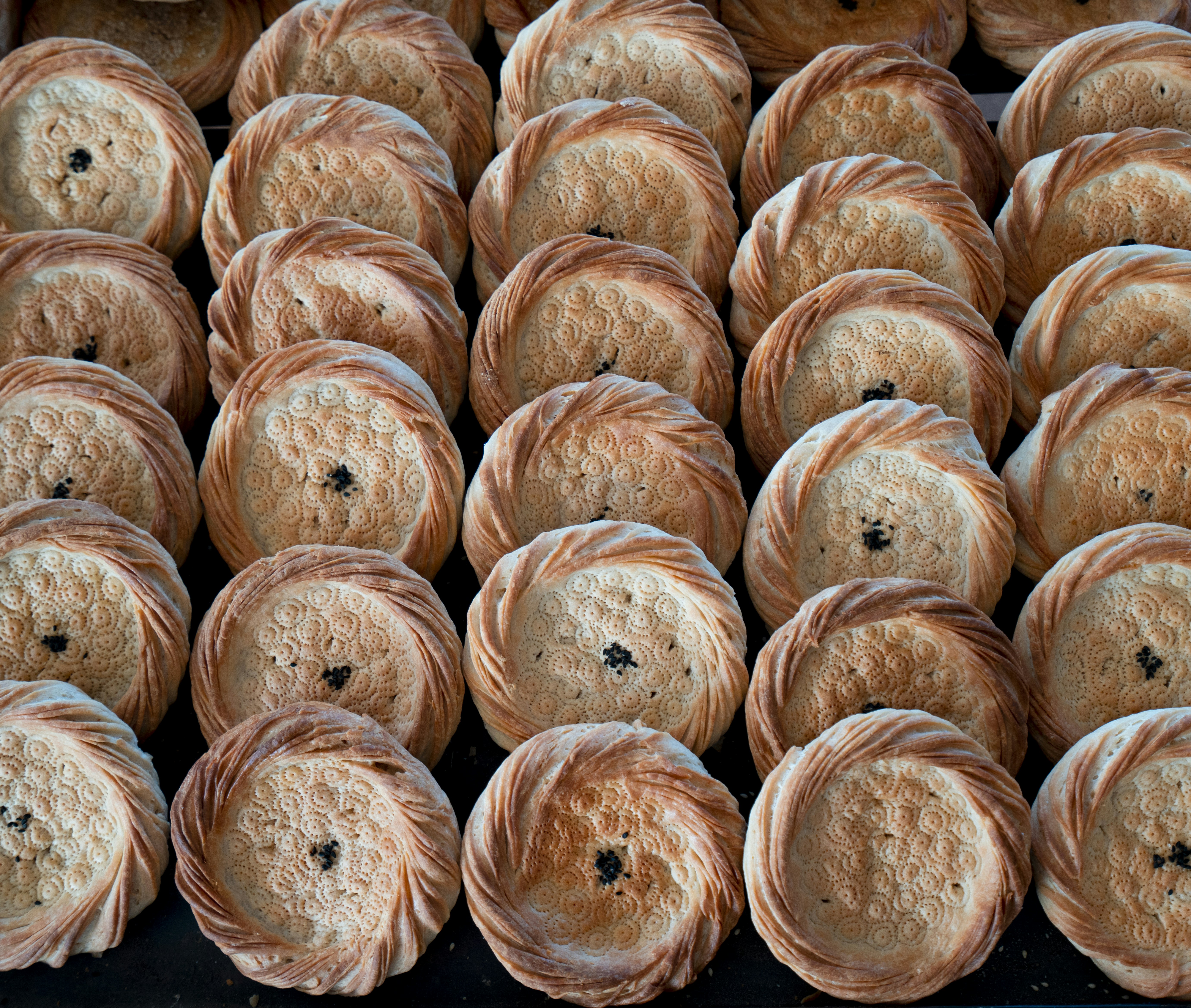 a bunch of breads that are sitting on a table