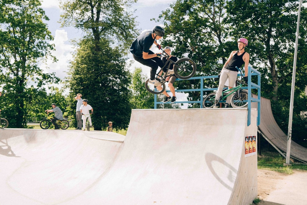 a man riding a skateboard up the side of a ramp