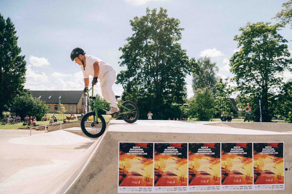 a man riding a skateboard up the side of a ramp