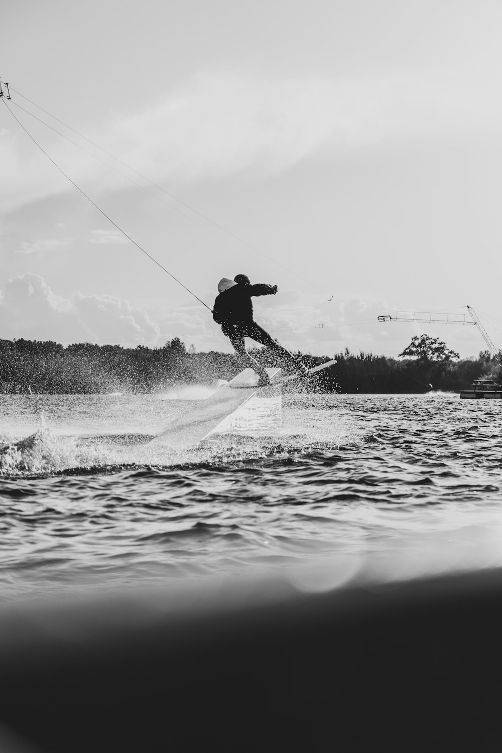 a man riding a board on top of a body of water