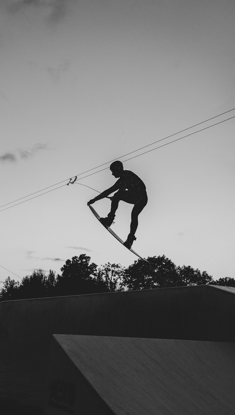 a man flying through the air while riding a snowboard