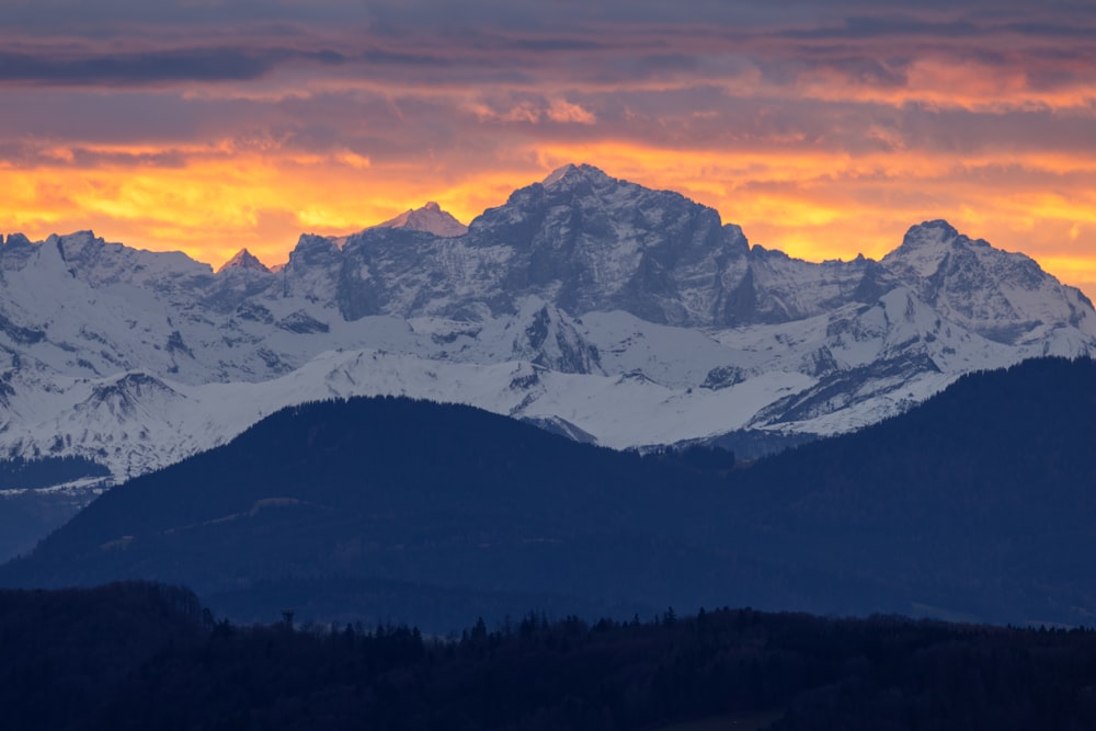 a view of a mountain range at sunset