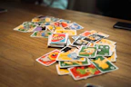 A playful spread of UNO cards fanned out on a wooden table.