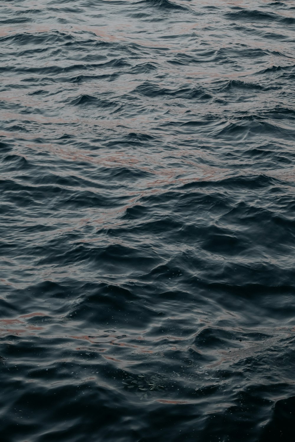 a boat floating on top of a large body of water