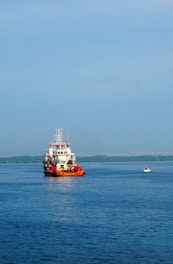 a large boat floating on top of a large body of water