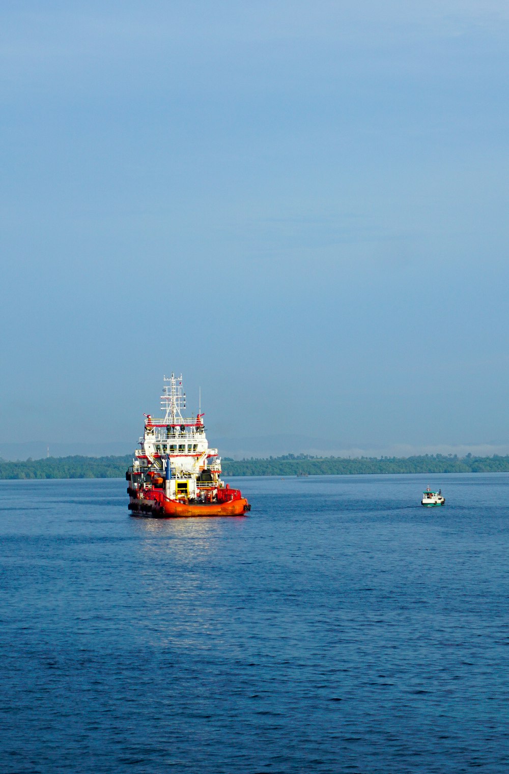 a large boat floating on top of a large body of water