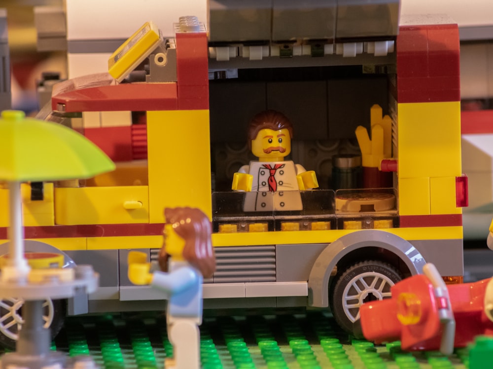 a lego fire truck with a man inside of it
