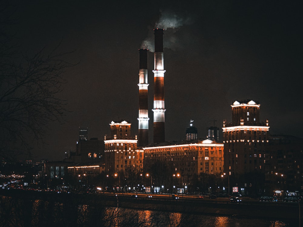 a large factory building with smoke coming out of it's stacks