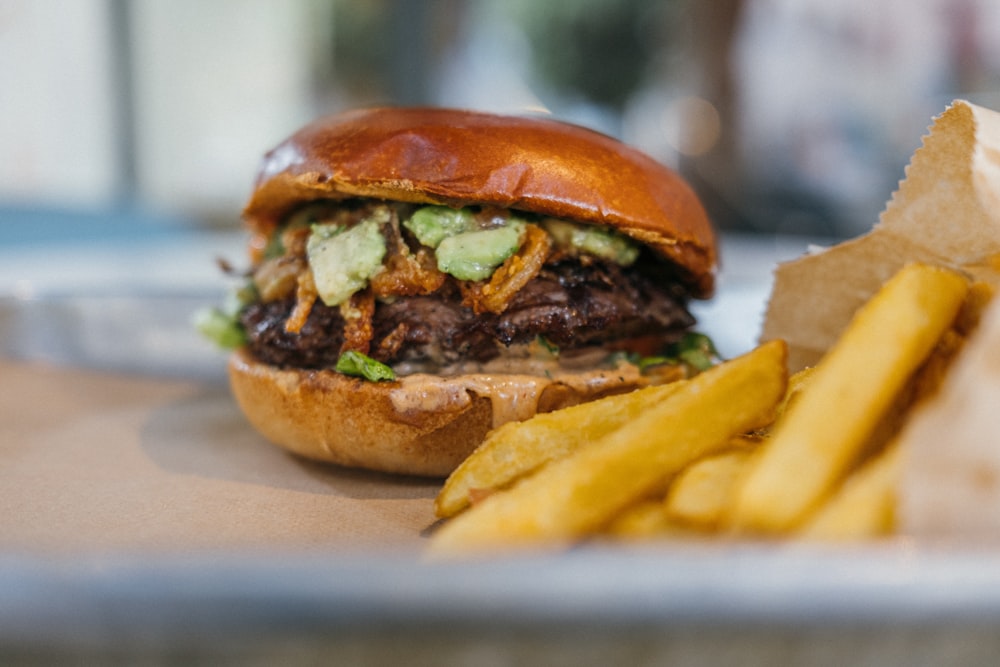 a close up of a sandwich and french fries