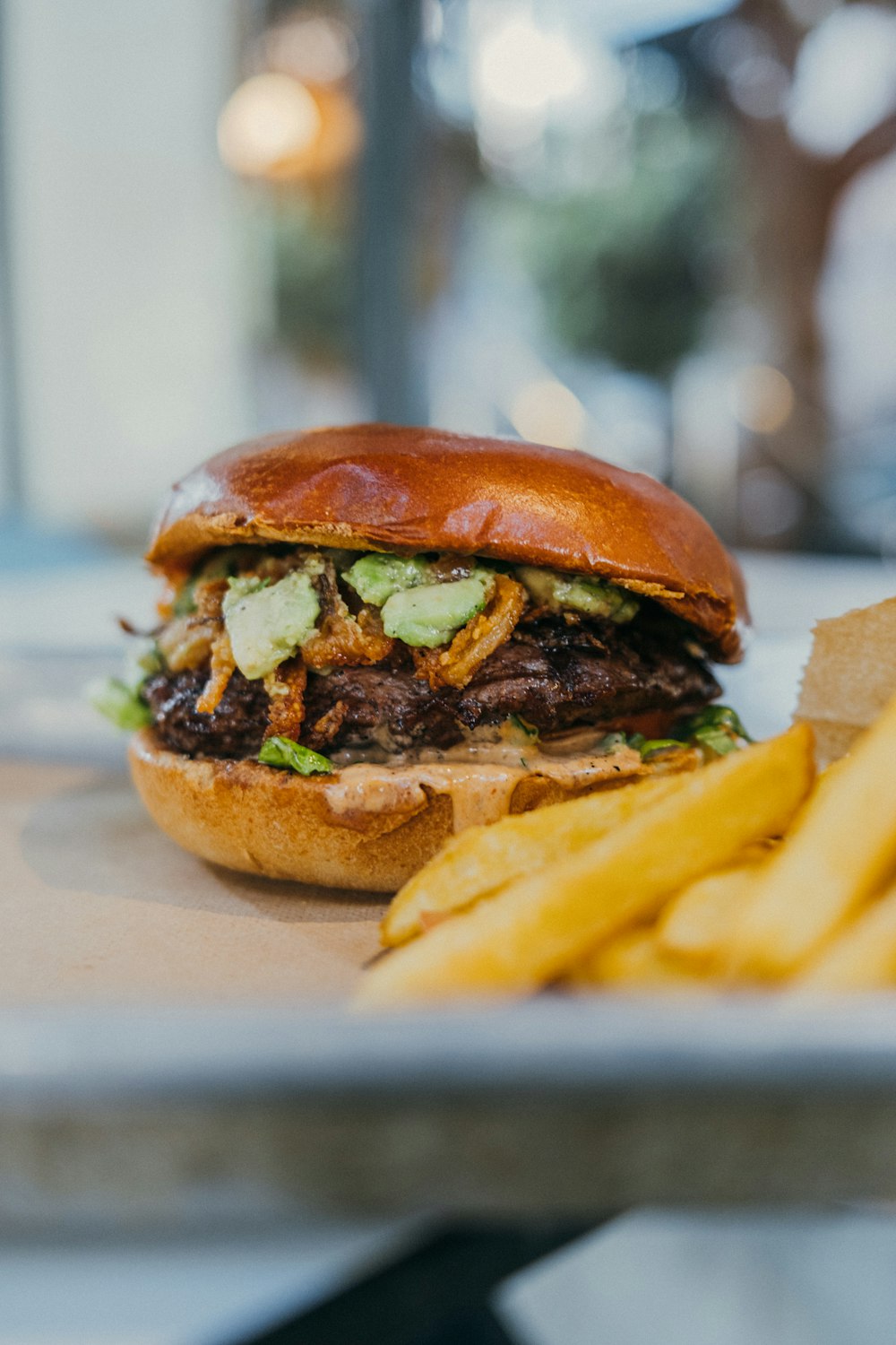 a close up of a sandwich and french fries