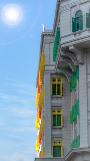 A vibrant exterior of a freshly painted building under sunlight.