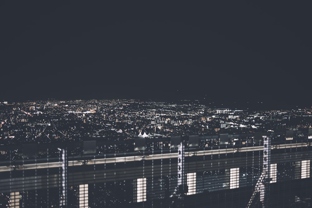 a view of a city at night from the top of a building