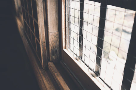Close-up of finely finished wooden window details with natural light.