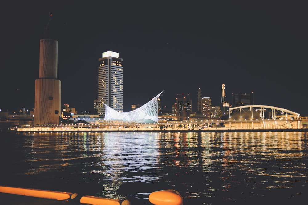 a large body of water with a city in the background