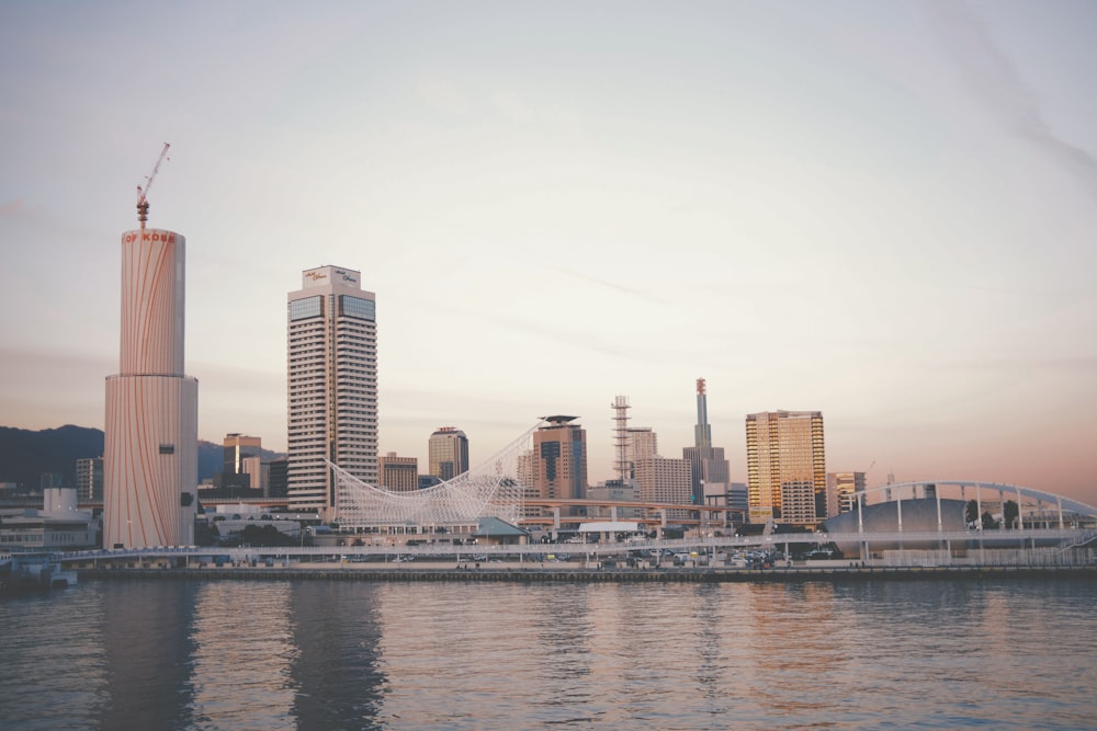 a large body of water with a city in the background