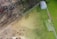 A before and after image of a cleaned yard.