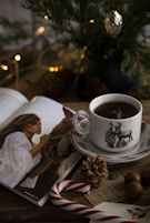 a cup of coffee and a book on a table