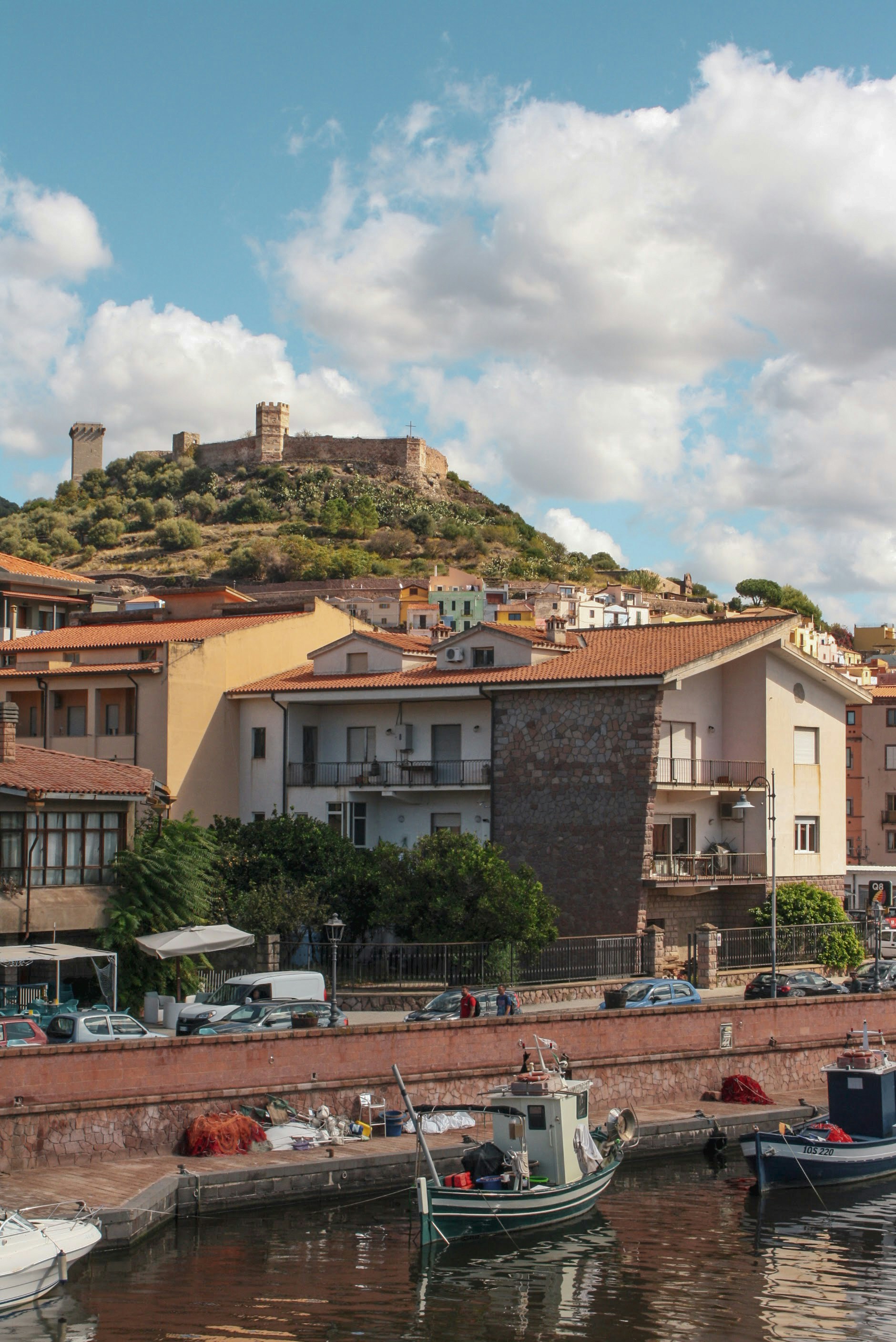 boat on shore near house