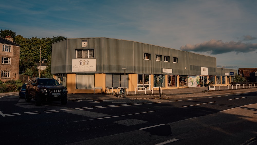 a large building sitting on the side of a road