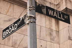 a couple of street signs on a metal pole