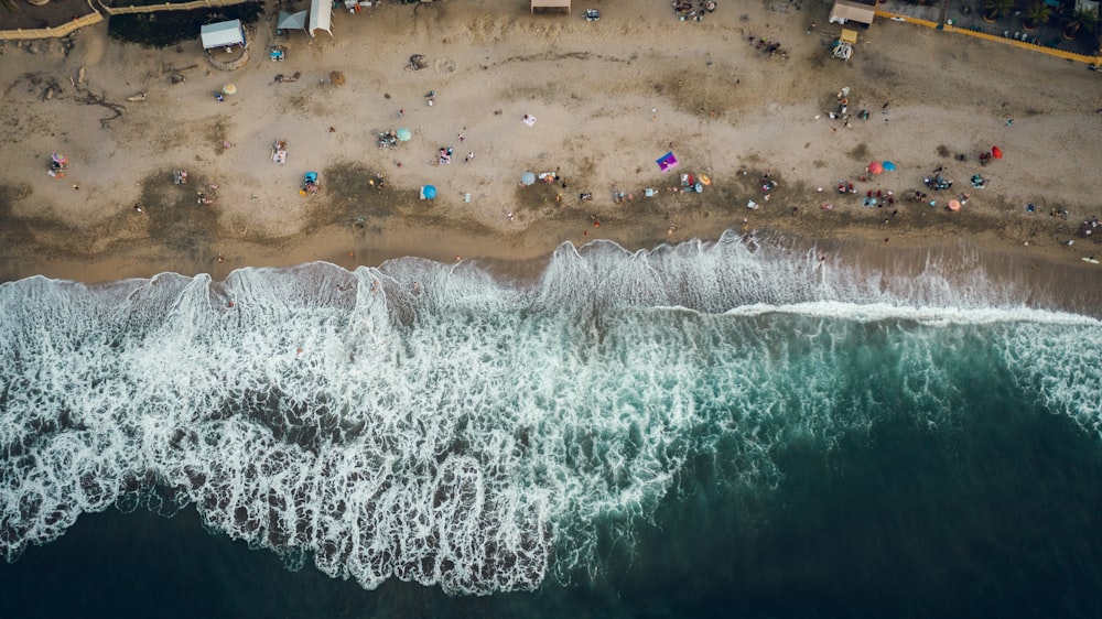 an aerial view of a beach with people on it