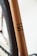 Close-up of a bicycle frame, highlighting details like the model number '53' and descriptors such as 'FabricBike Europe' and 'Hi-Ten Steel 700 Tig Welded'. The frame has a smooth, metallic finish with a minimalist design.