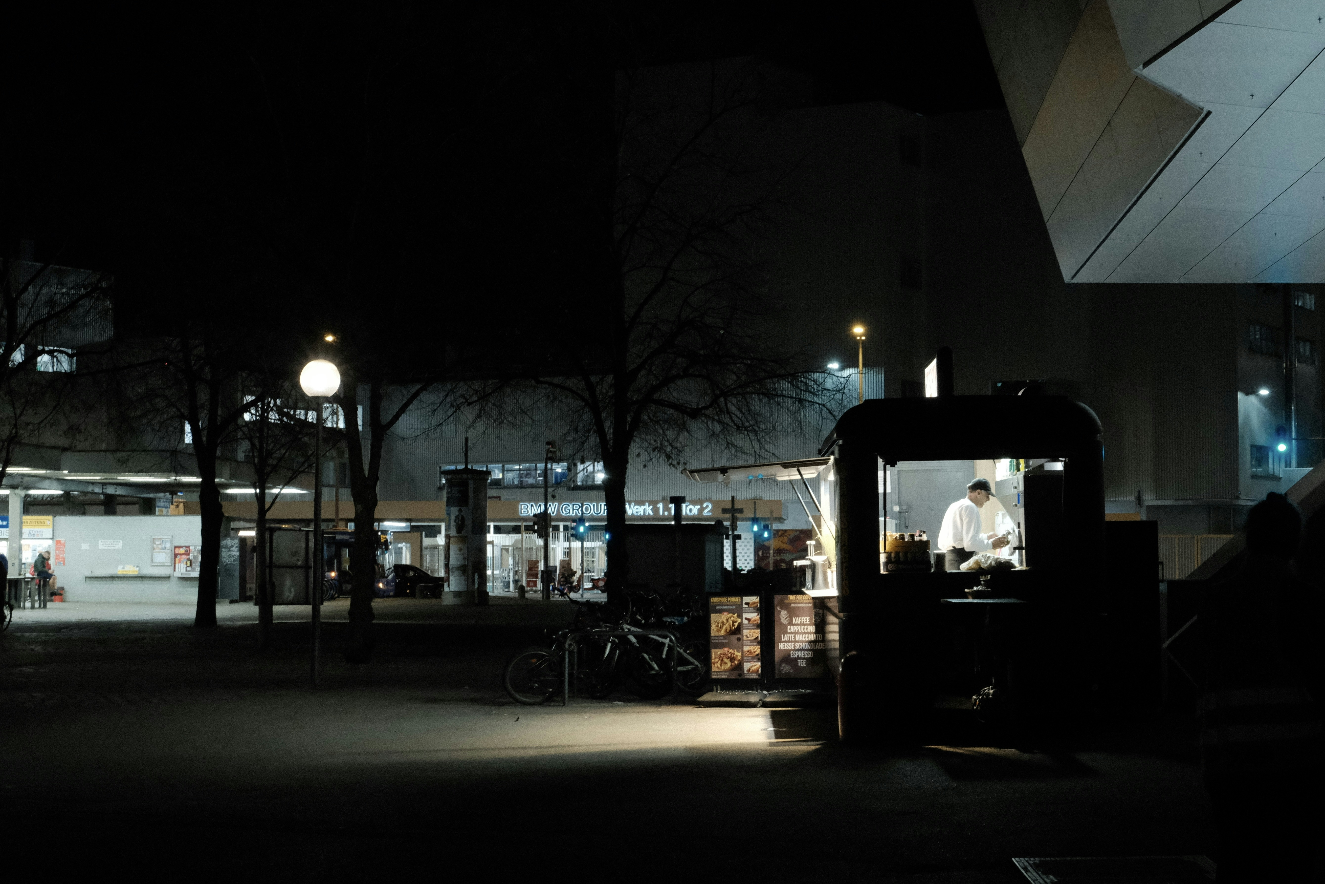 a man sitting in a chair in the dark