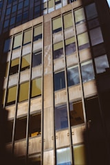 Commercial building with glass facade reflecting the sky