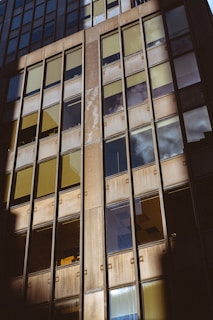Commercial building facade with large glass windows.