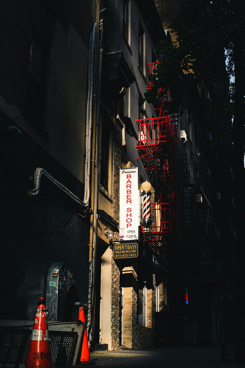 a fire escape sign on a building in the dark