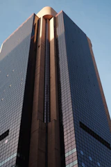 An elegant office tower in Pune reflecting sunlight, signifying thriving commercial real estate.