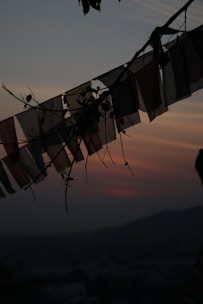 A serene image of traditional azadari flags fluttering gently during a calm evening.