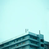 Wide shot of a commercial building with a newly replaced flat roof.