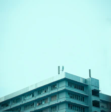 Wide shot of a commercial building showing new flat roofing installation.