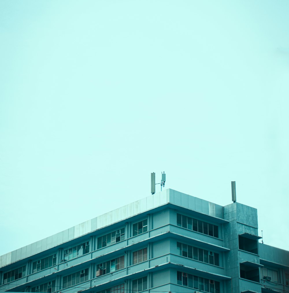 a tall building with a traffic light on top of it